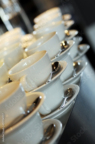 Photo: Coffee cups with spoons in a restaurant Coffee cups with spoons in a restaurant