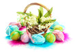 Beautiful easter eggs and lilies of the valley in basket ,