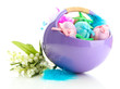 Beautiful easter eggs in basket and lilies of the valley,