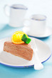 Piece of chocolate orange crepe cake, selective focus
