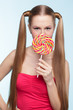 Young woman with lollipop