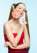 Young woman with lollipop