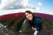 Pretty woman in field of tulips