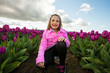 child in tulip field