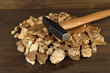 Golden nuggets with hummer on wooden background
