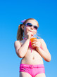 Photo: little girl drinks orange juice little girl drinks orange juice
