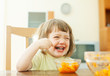 Happy  girl eating carrot salad