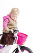 Foto: little girl riding bike little girl riding bike