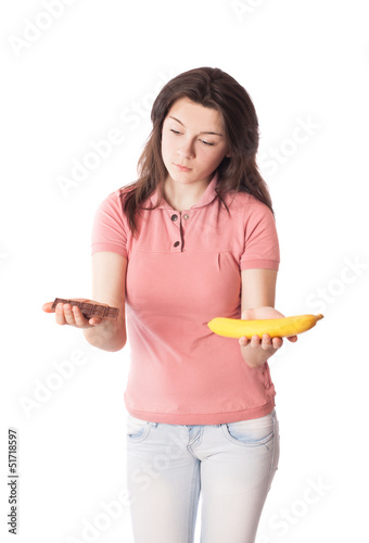 Photo: girl with chocolate and banana isolated on white girl with chocolate and banana isolated on white
