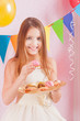 girl in birthday party with cakes