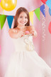 girl in birthday party with cakes
