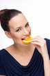 Girl eating orange