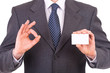 Business man showing blank card.