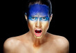 Screaming woman with golden face