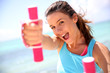 Photo: Cheerful girl lifting weights Cheerful girl lifting weights