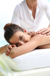 Foto: Brunette girl receiving a massage Brunette girl receiving a massage