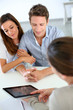 Photo: Young couple meeting financial adviser Young couple meeting financial adviser