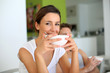 Portrait of young woman having breakfast