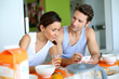Couple having breakfast at home