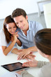 Young couple meeting financial adviser