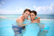 Couple having fun in swimming-pool