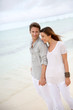 Romantic couple walking on the beach
