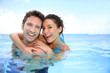 Couple having fun in swimming-pool