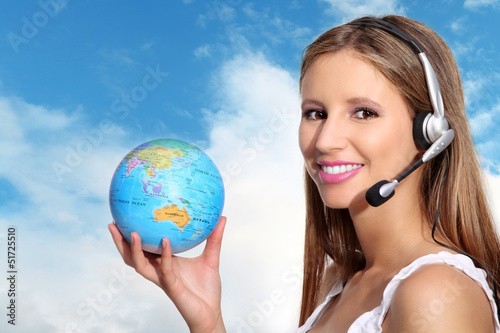 Photo: receptionist with headphones and globe receptionist with headphones and globe