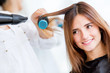 Woman blow drying her hair