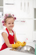Photo: Little girl with big curls doing the dishes Little girl with big curls doing the dishes