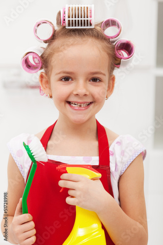 Photo: Little girl with cleaning utensils Little girl with cleaning utensils