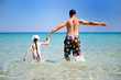 Photo: Happy father and his daughter ready to swim Happy father and his daughter ready to swim