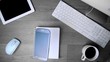 Smartphone phone falling on office desk in black and white