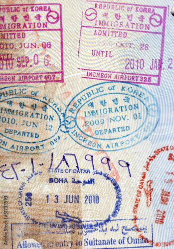Photo: Background of passport stamps closeup Background of passport stamps closeup