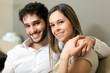 Lovely couple sitting on the sofa