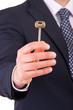 Businessman holding key.
