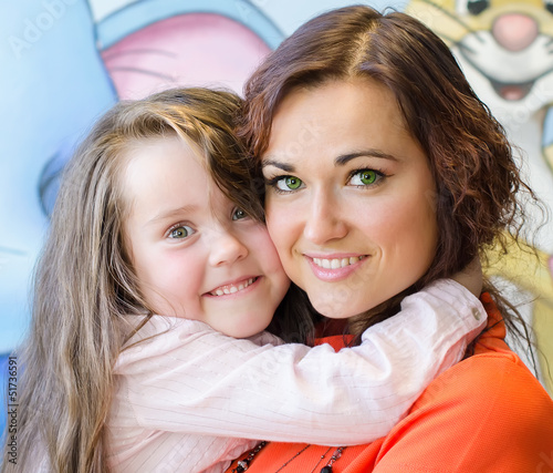 Photo: Mother and daughter hugging each other Mother and daughter hugging each other
