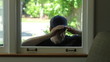 Intruder trying to enter window of home