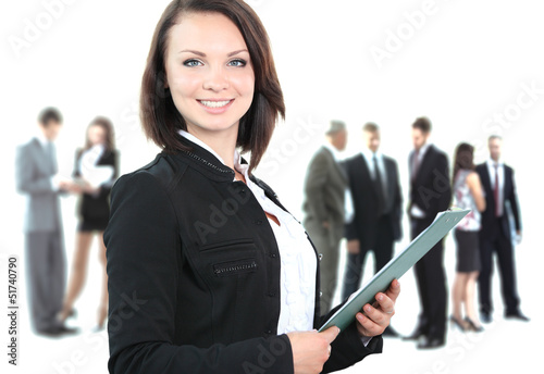 Photo: Face of beautiful woman on the background of business people Face of beautiful woman on the background of business people