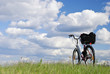 Bike on a grass against clouds