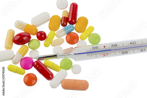 Photo: thermometer and pills thermometer and pills