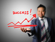 Photo: Business man showing success Business man showing success