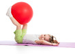 Sportive kid having fun with  gymnastic ball isolated