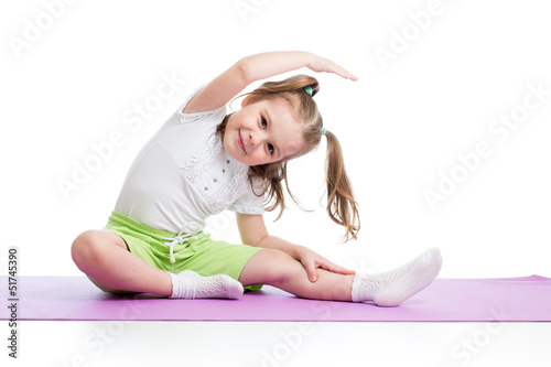 Photo: Kid doing fitness exercises Kid doing fitness exercises