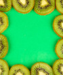 Kiwi slices frame on color background