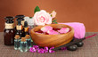Spa composition with aroma oils on brown background