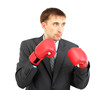 Businessman in boxing gloves isolated on white