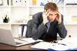 Young businessman in office at his workplace