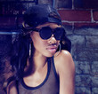 African American woman wearing sunglasses cap
