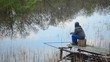 Video: Man with a fishing pole fishing in a pond Man with a fishing pole fishing in a pond